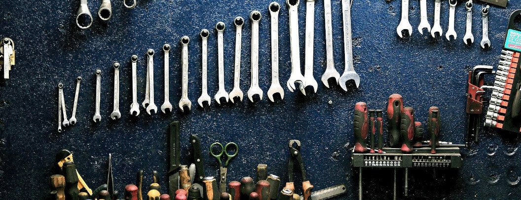 Tool wall on which a variety of hand tools are neatly arranged