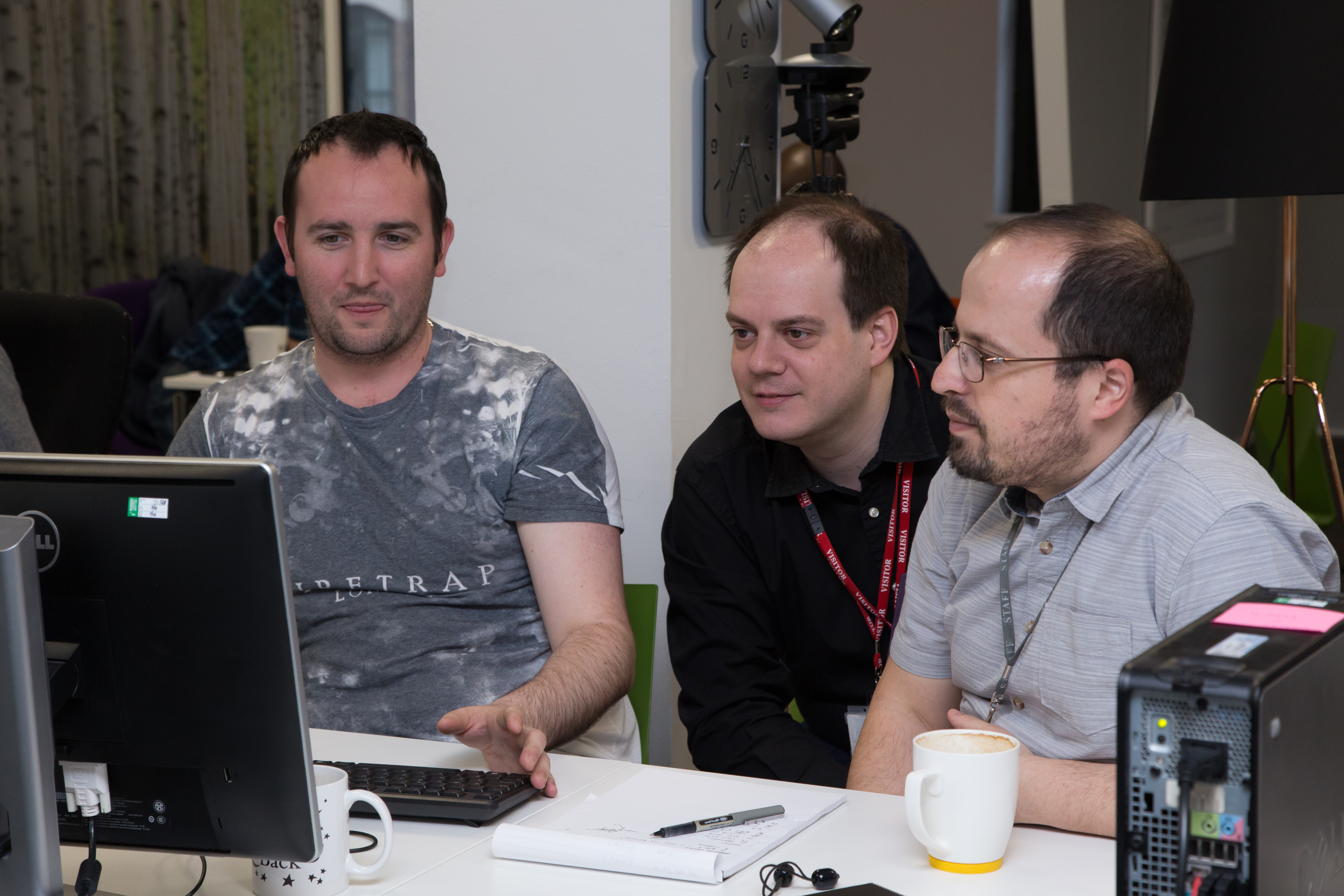 A team of developers working together at a table
